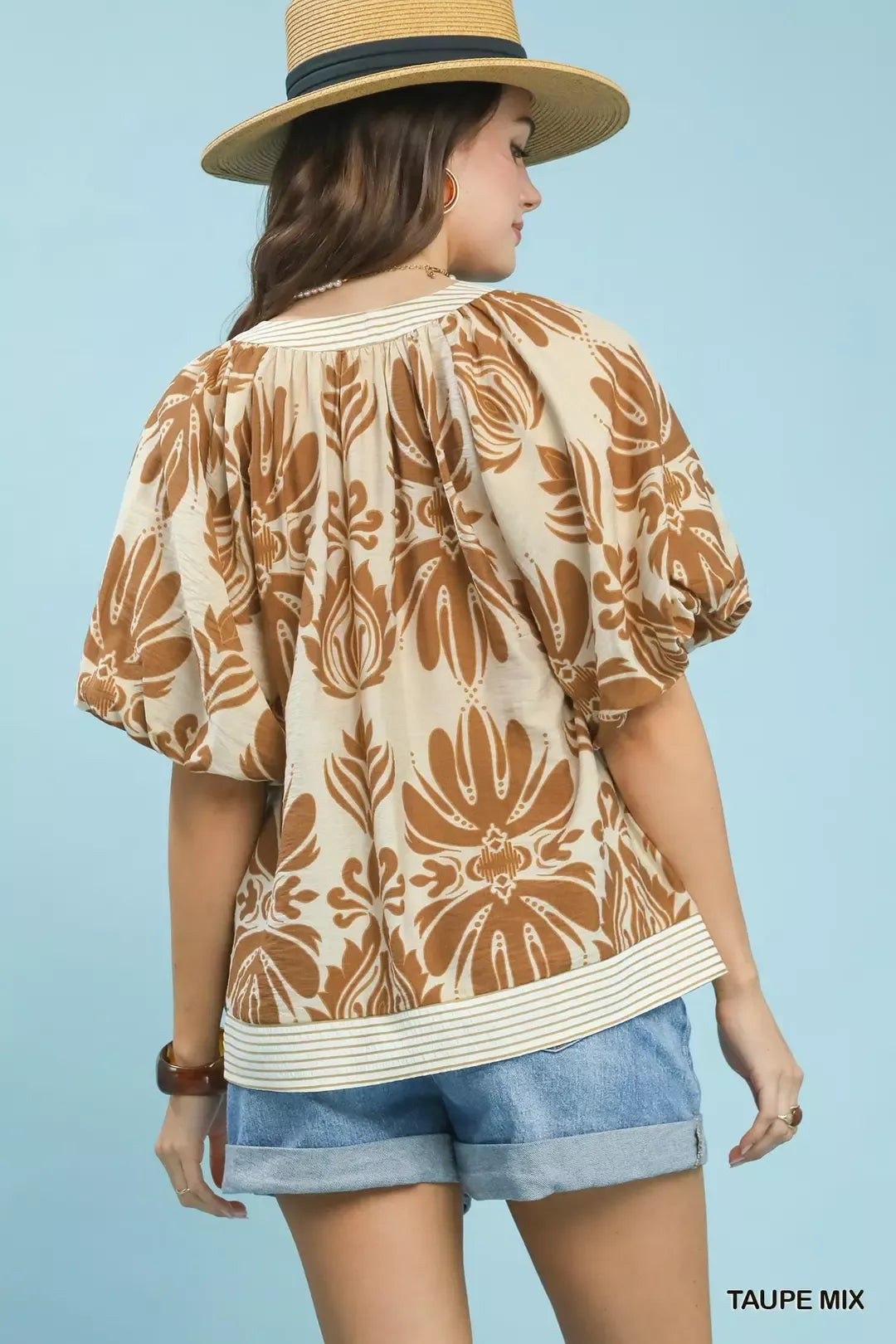Taupe Umgee printed puff sleeve top with contrast trim, featuring mixed patterns and stylish design, perfect for casual wear.