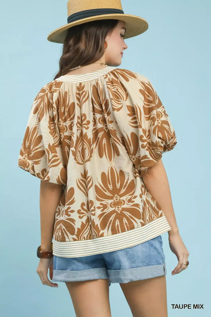 Taupe Umgee printed puff sleeve top with contrast trim, featuring mixed patterns and stylish design, perfect for casual wear.