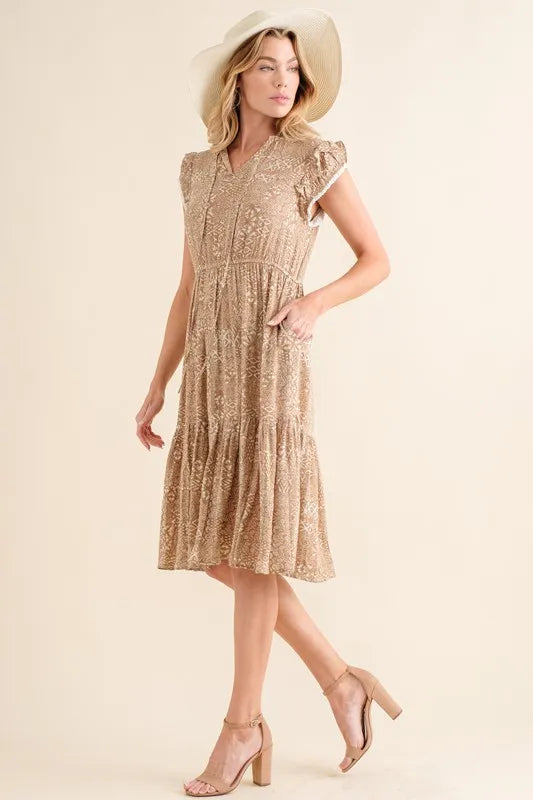 Taupe boho printed tiered maxi dress by Trendsi, featuring flowy layers and bohemian style perfect for casual summer wear.