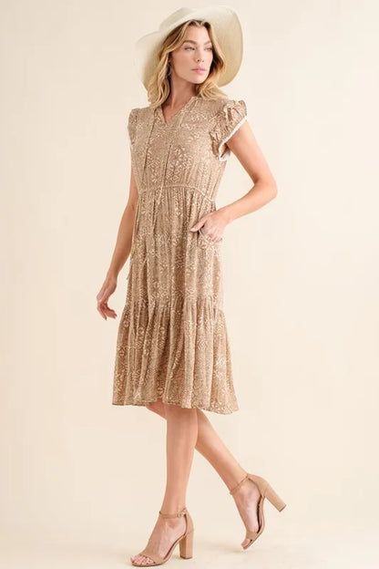 Taupe boho printed tiered maxi dress by Trendsi, featuring flowy layers and bohemian style perfect for casual summer wear.