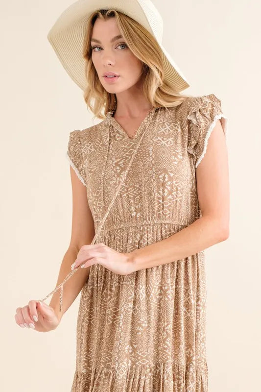Taupe boho printed tiered maxi dress by And The Why from Trendsi, featuring flowing fabric and intricate print details.