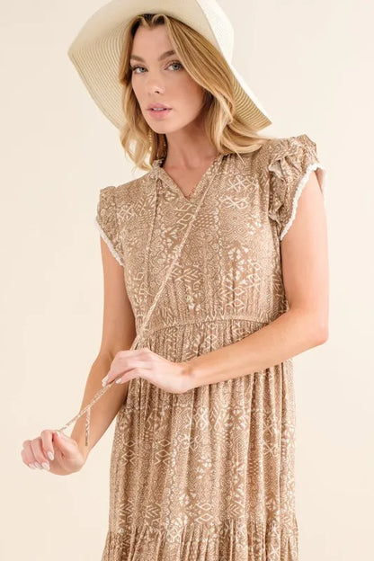Taupe boho printed tiered maxi dress by And The Why from Trendsi, featuring flowing fabric and intricate print details.