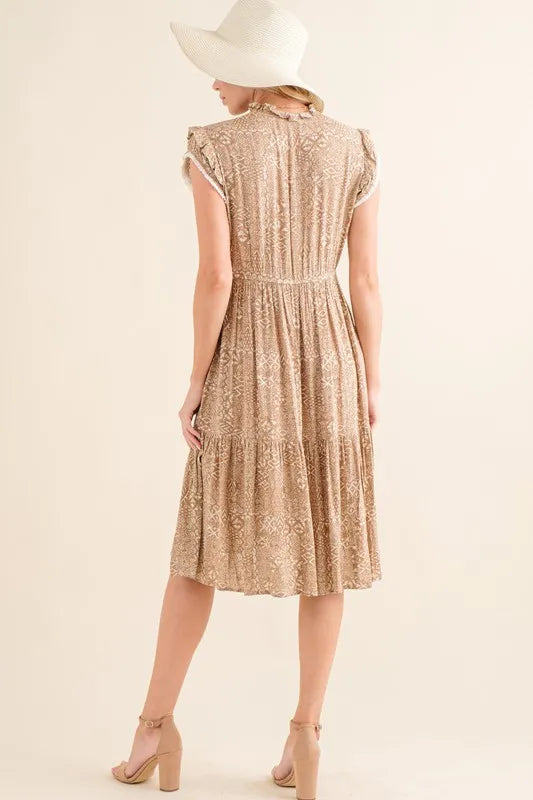 Taupe boho printed tiered maxi dress by Trendsi featuring flowing fabric and bohemian-inspired design.