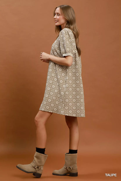 Taupe Umgee floral textured puff sleeve mini dress featuring a fitted silhouette and stylish short puff sleeves.