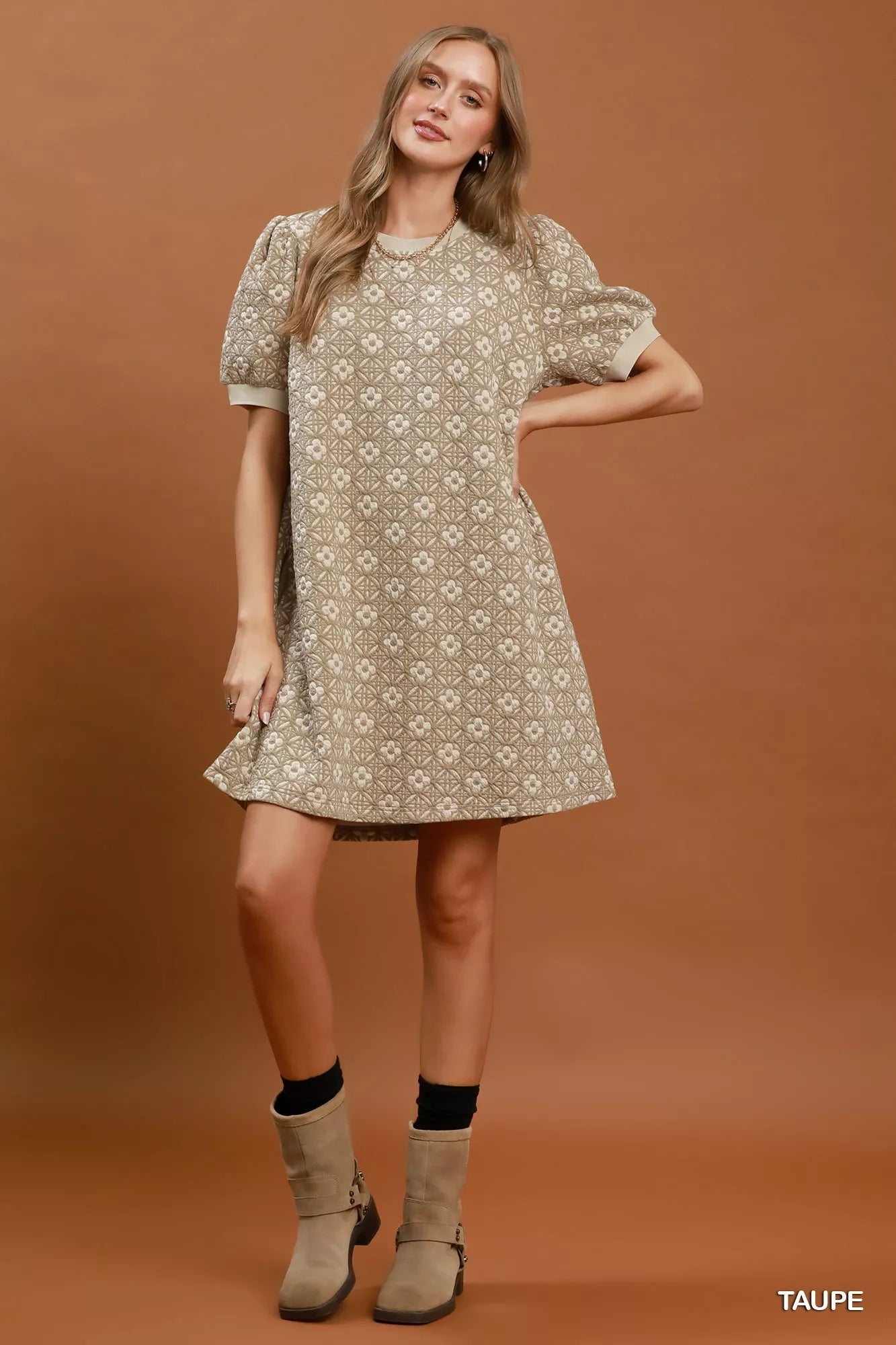 Taupe Umgee floral textured puff sleeve mini dress with a fitted silhouette and feminine design.