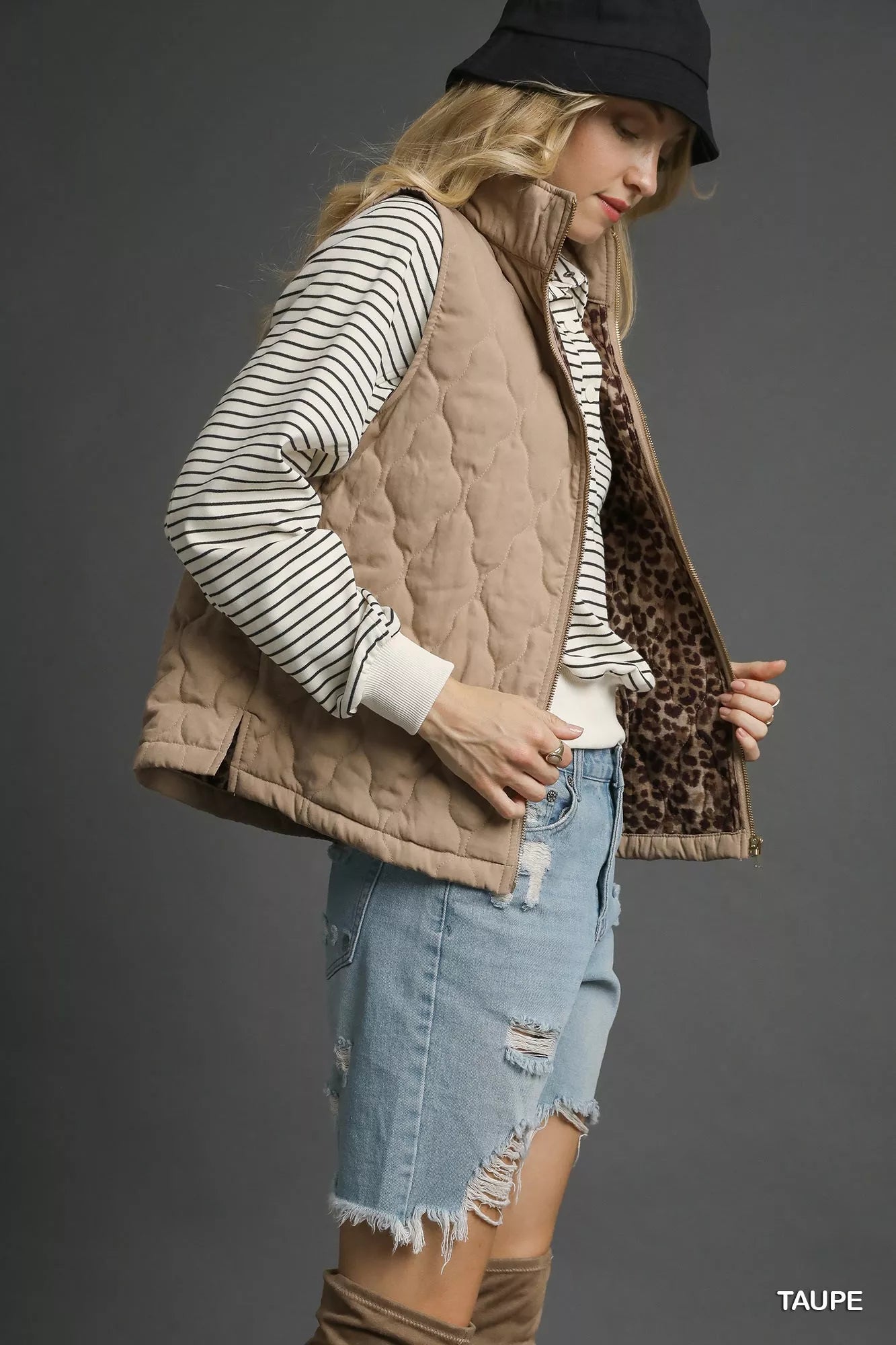 Taupe Umgee quilted zip-up vest by Trendsi, featuring a stand collar and front zipper, shown on a model.