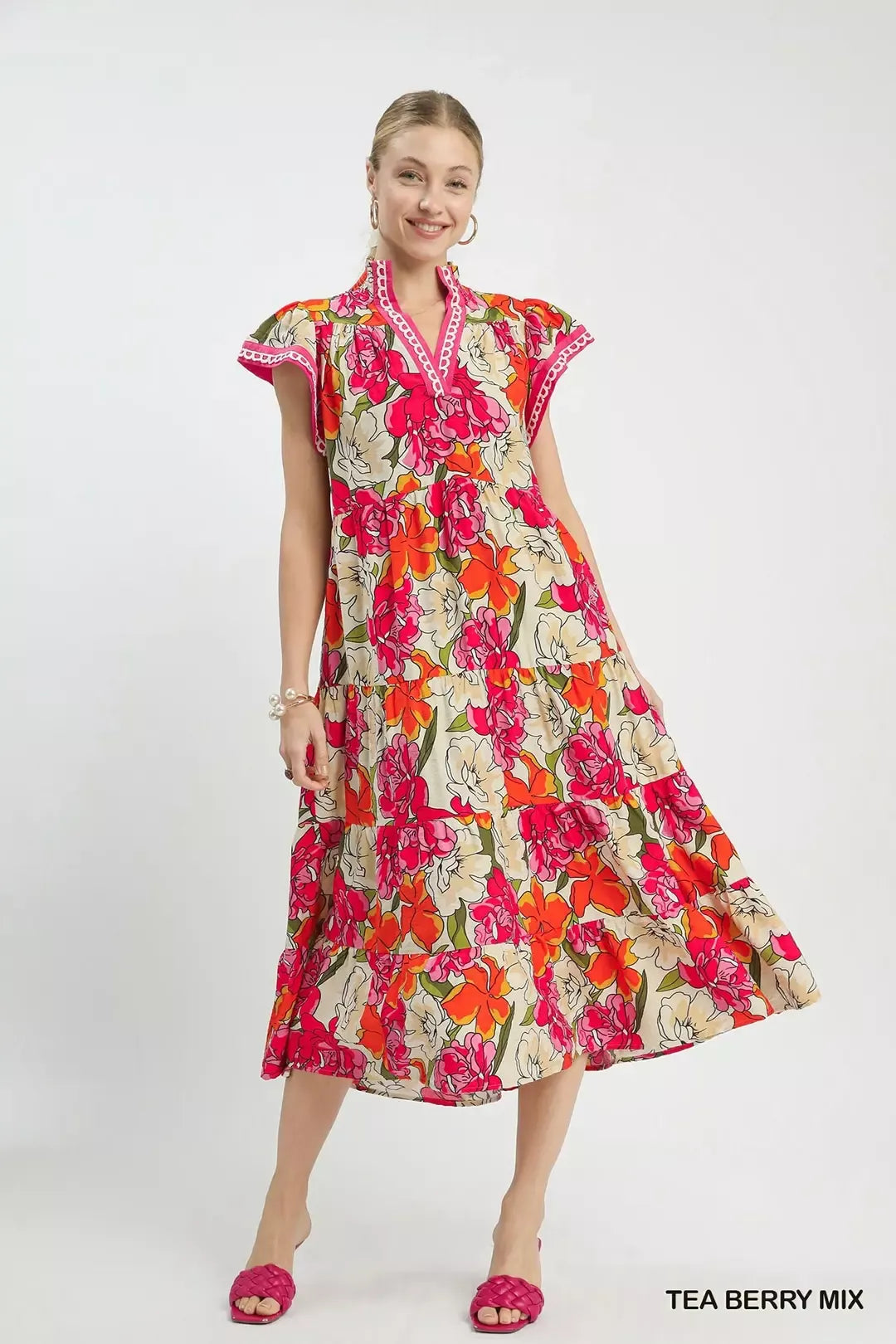 Trendy Umgee Mix Bold Floral Tiered Midi Dress featuring vibrant floral pattern and flowing silhouette, perfect for spring and summer.