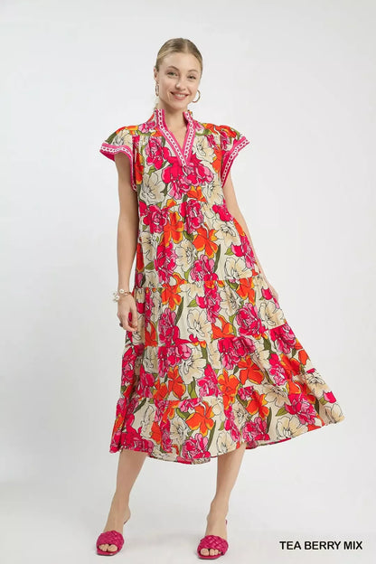 Trendy Umgee Mix Bold Floral Tiered Midi Dress featuring vibrant floral pattern and flowing silhouette, perfect for spring and summer.