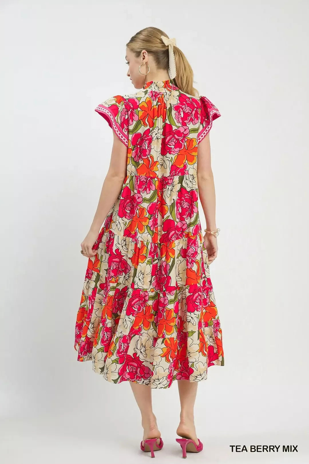 Trendsi Umgee Mix Bold Floral Tiered Midi Dress featuring vibrant floral pattern and flowing tiered design on lightweight fabric.