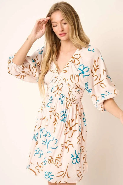 Teal flower print Mini Dress by Mittoshop with mocked waist, short sleeves, and a stylish, casual design.