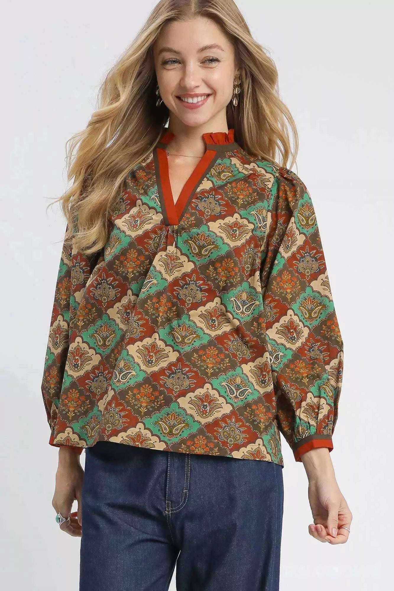 Teal and green abstract print ruffle neck top by Umgee, featuring a stylish design and feminine ruffle detail.