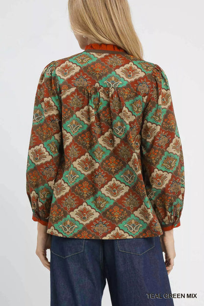 Teal green abstract print ruffle neck top by Umgee, featuring a stylish design and flowy fit, perfect for casual or dressy occasions.