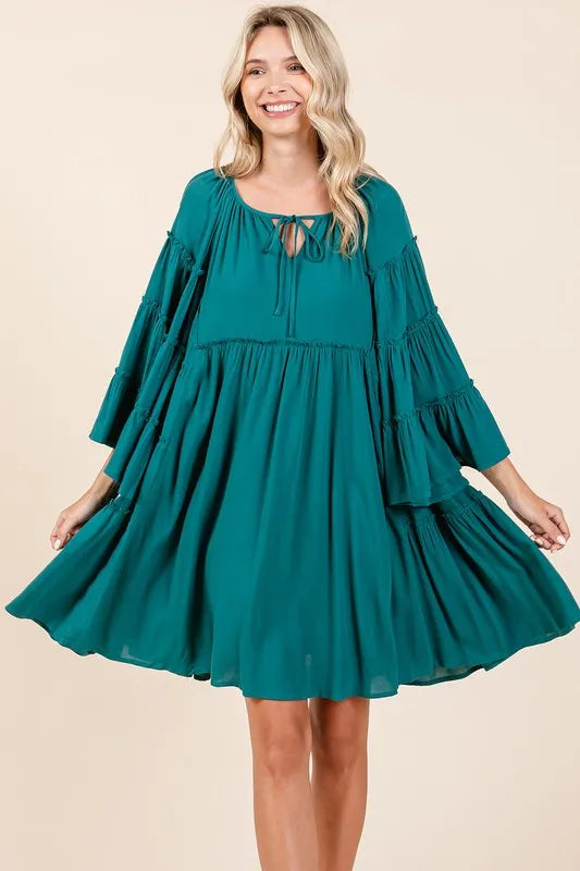 Teal green Mittoshop bell sleeve dress with tie neck and frill details, stylish and flowy for casual or dressy occasions.