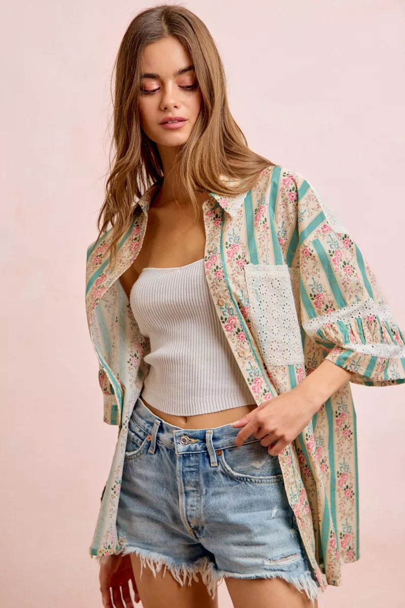 Teal BiBi eyelet lace and floral mix-and-match shirt top by Trendsi, featuring eyelet details and floral accents.