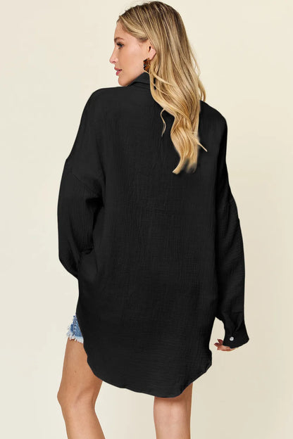Teal double take full-size pocketed textured button-up shirt by Trendsi, displayed on a hanger.