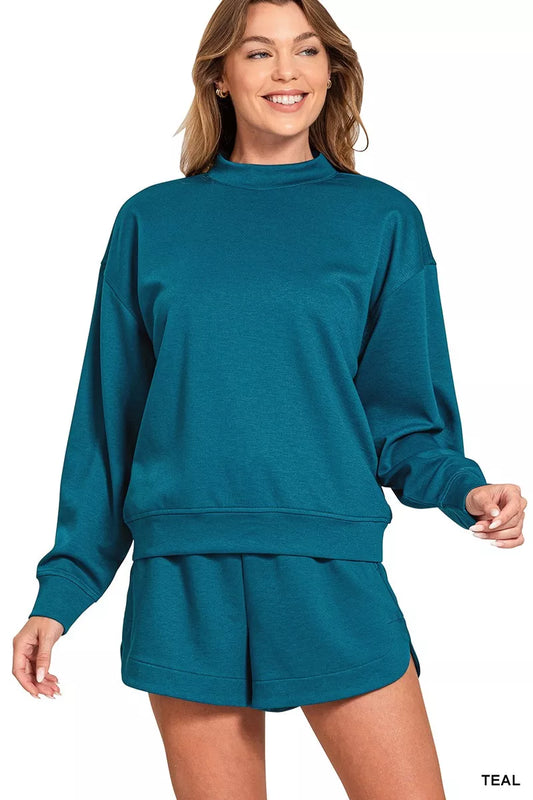 Teal Zenana Scuba long sleeve sweatshirt and shorts set by Trendsi, shown on a model with a casual, sporty style.