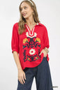 Umgee Mixed Media V-Neck Print Blouse with floral and abstract patterns, stylish women’s top in vibrant colors.
