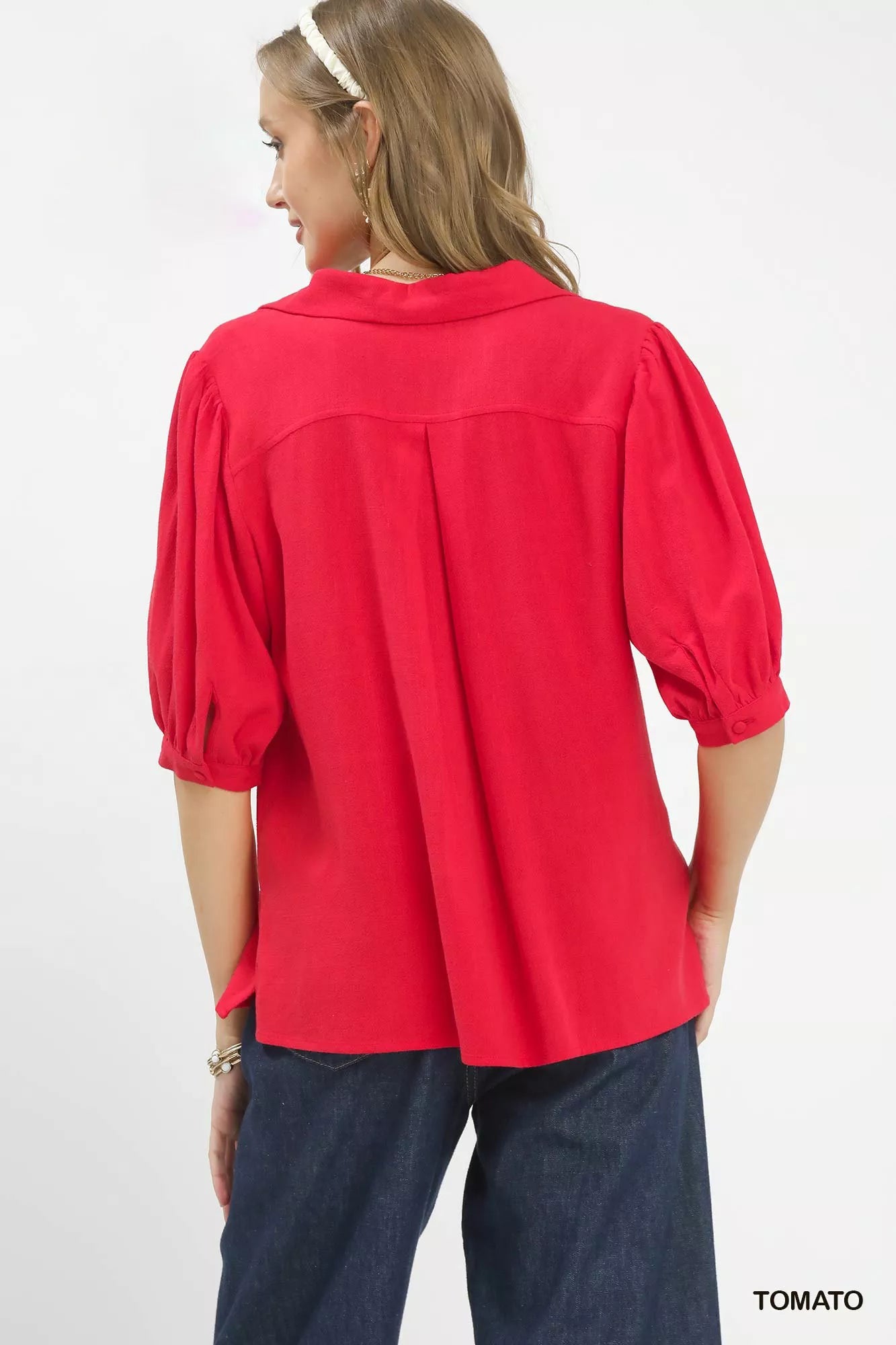 Umgee mixed media V-neck print blouse with long sleeves and colorful pattern, styled on a model for casual wear.