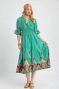 Turquoise Umgee printed midi dress with smocked waist and flounce sleeves, showcasing a stylish boho-inspired design.