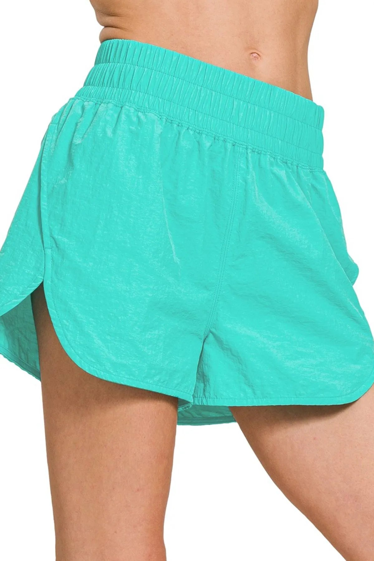 Turquoise Zenana windbreaker running shorts with smocked waistband, designed for active wear and comfortable movement.
