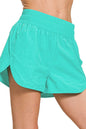 Turquoise Zenana windbreaker running shorts with smocked waistband, designed for active wear and comfortable movement.