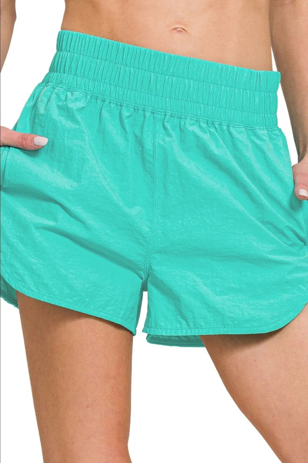 Turquoise Zenana windbreaker running shorts with smocked waistband, lightweight and sporty, designed for active wear.