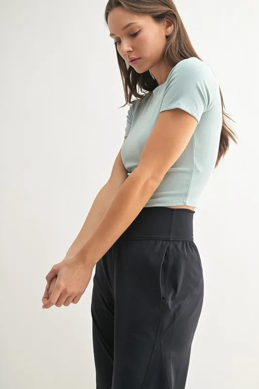 Trendsi MONO B Essential micro-ribbed cropped athleisure tee in vintage blue, featuring a fitted, textured design.