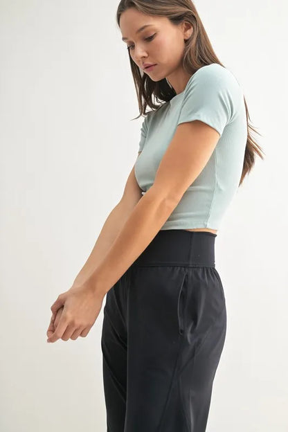 Trendsi MONO B Essential micro-ribbed cropped athleisure tee in vintage blue, featuring a fitted, textured design.