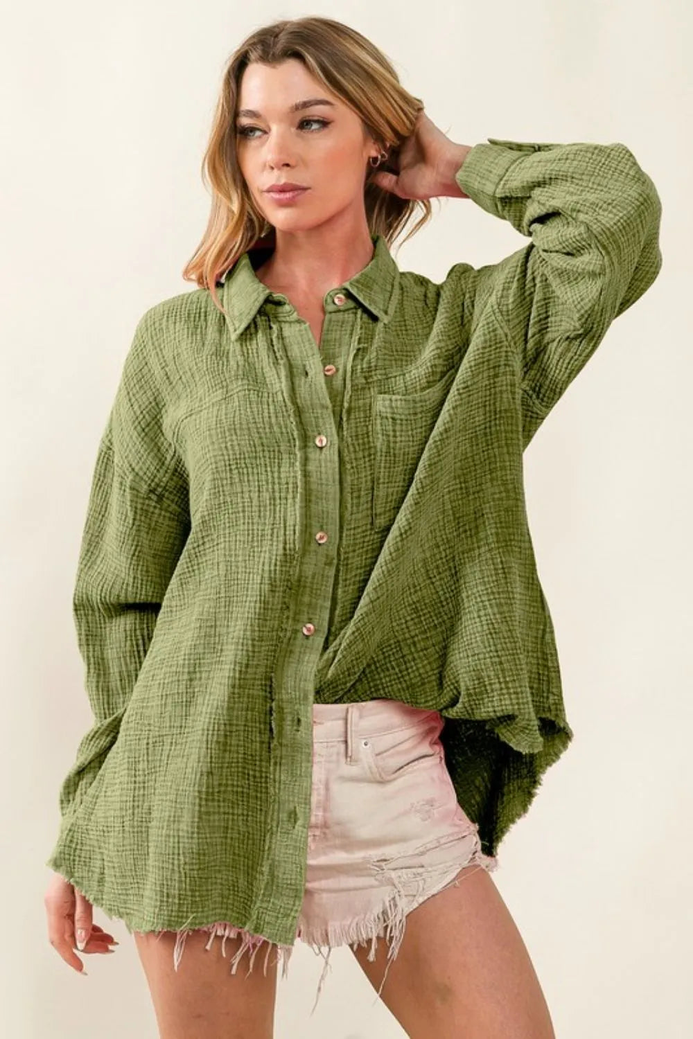 Vintage olive green BiBi raw edge loose fit shirt by Trendsi with mineral wash and detailed design, casual and stylish for everyday wear.