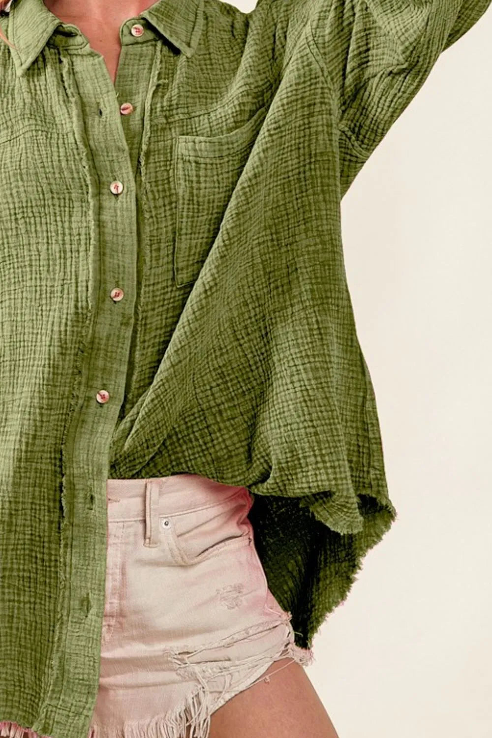 Olive green BiBi raw edge loose fit shirt by Trendsi with mineral wash and detailed stitching, casual and comfortable fit.