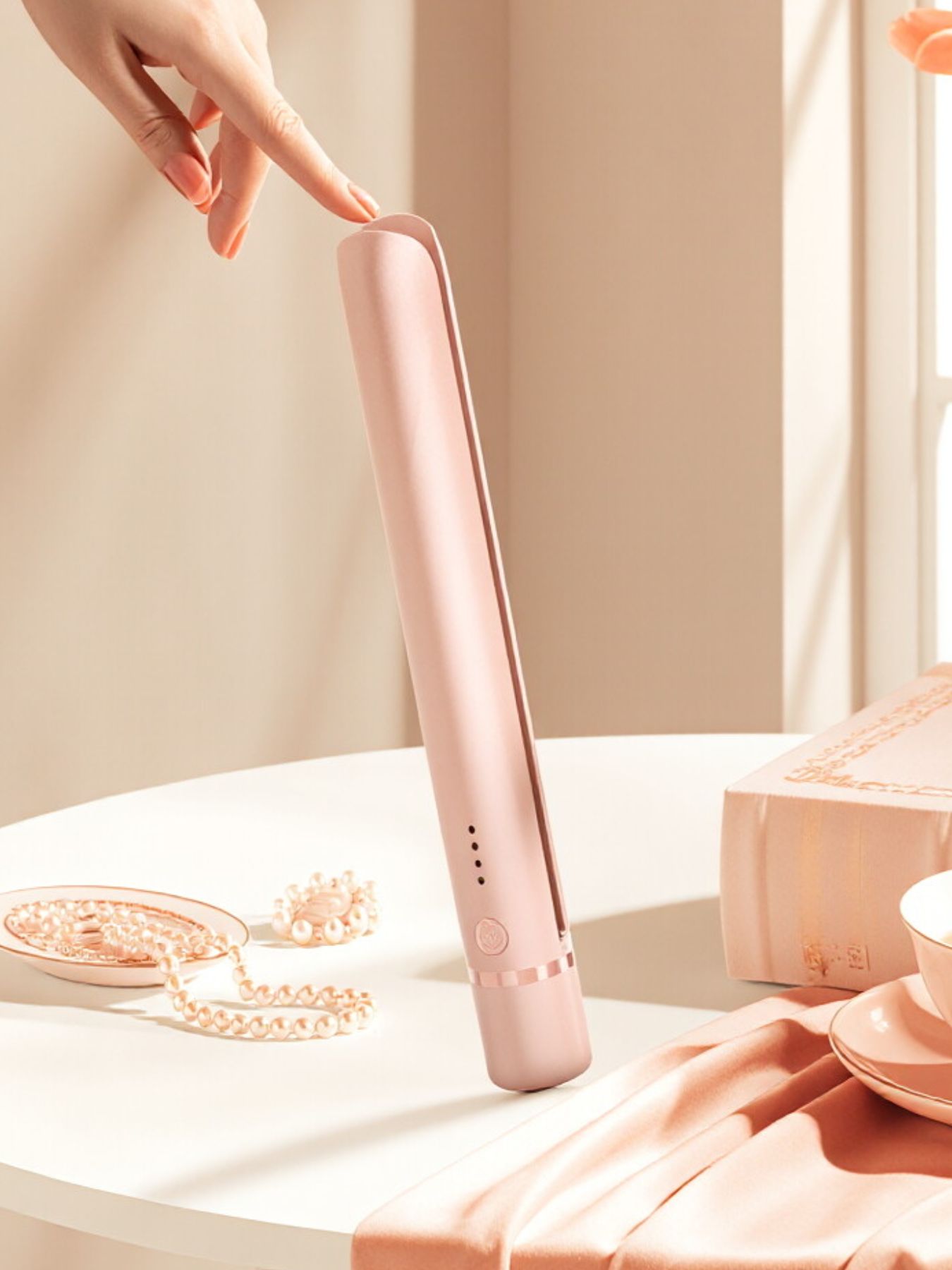 Watermelon pink ceramic hair straightener by Trendsi, with sleek design and ceramic plates for smooth styling.