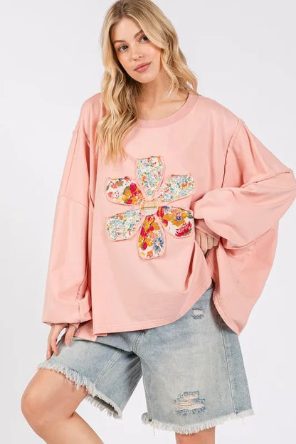 Watermelon pink oversized top with sage and fig flower patch details, dropped shoulder design, casual and trendy style.