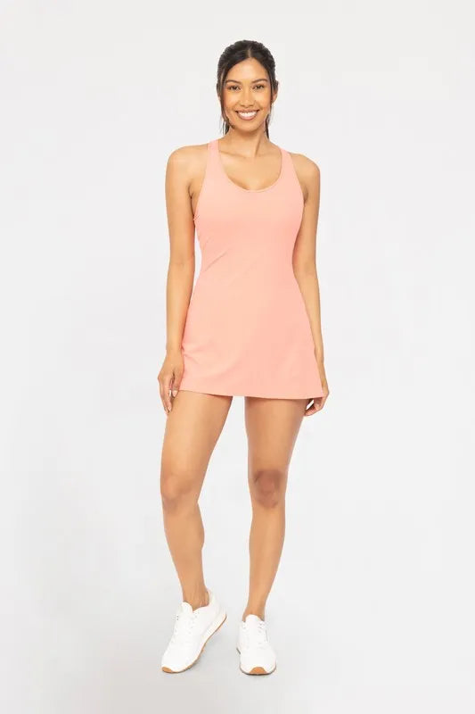 Watermelon pink MONO B Twist Racerback Fit-and-Flare Dress from Trendsi, showing the sleeveless design and flattering silhouette.