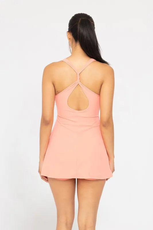 Watermelon pink Mono B twist racerback fit-and-flare dress with sleeveless design and flared skirt, displayed on a mannequin.