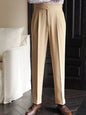White men's pleated wide-leg dress pants by Trendsi, tailored fit with sharp pleats and a classic waistband, styled for formal occasions.