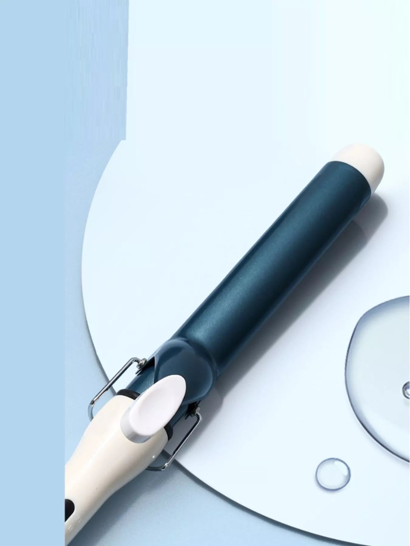 White ceramic curling iron wand with European plug from Trendsi, designed for creating smooth, curly hairstyles.