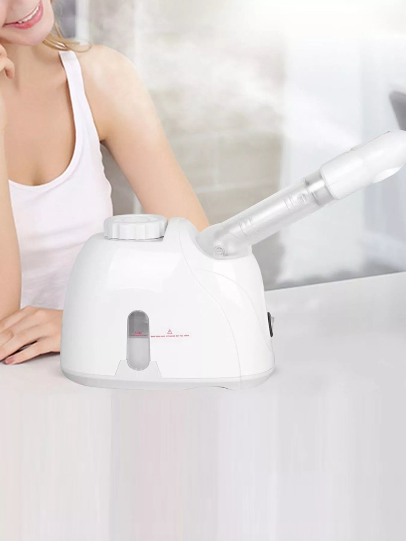 White facial steamer deep cleansing device by Trendsi with European plug, designed for facial hydration and skin purification.