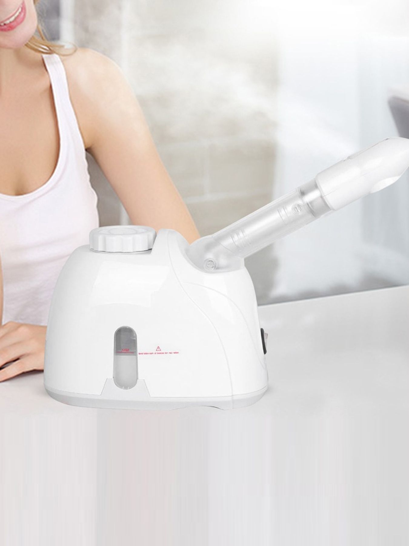 White Trendsi hot steaming facial beauty device with European plug, used for skincare and facial steaming treatments.