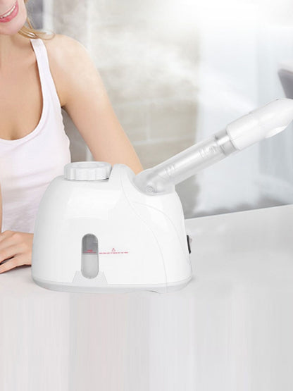 White Trendsi hot steaming facial beauty device with European plug, used for skincare and facial steaming treatments.