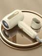 White portable negative ion hair dryer with European plug from Trendsi, compact design for quick styling and hair health.