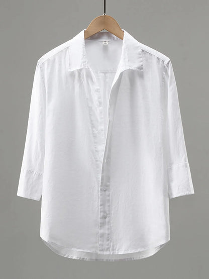 Men's plus size white button-up long sleeve shirt by Trendsi, displayed flat showing collar, buttons, and long sleeves.