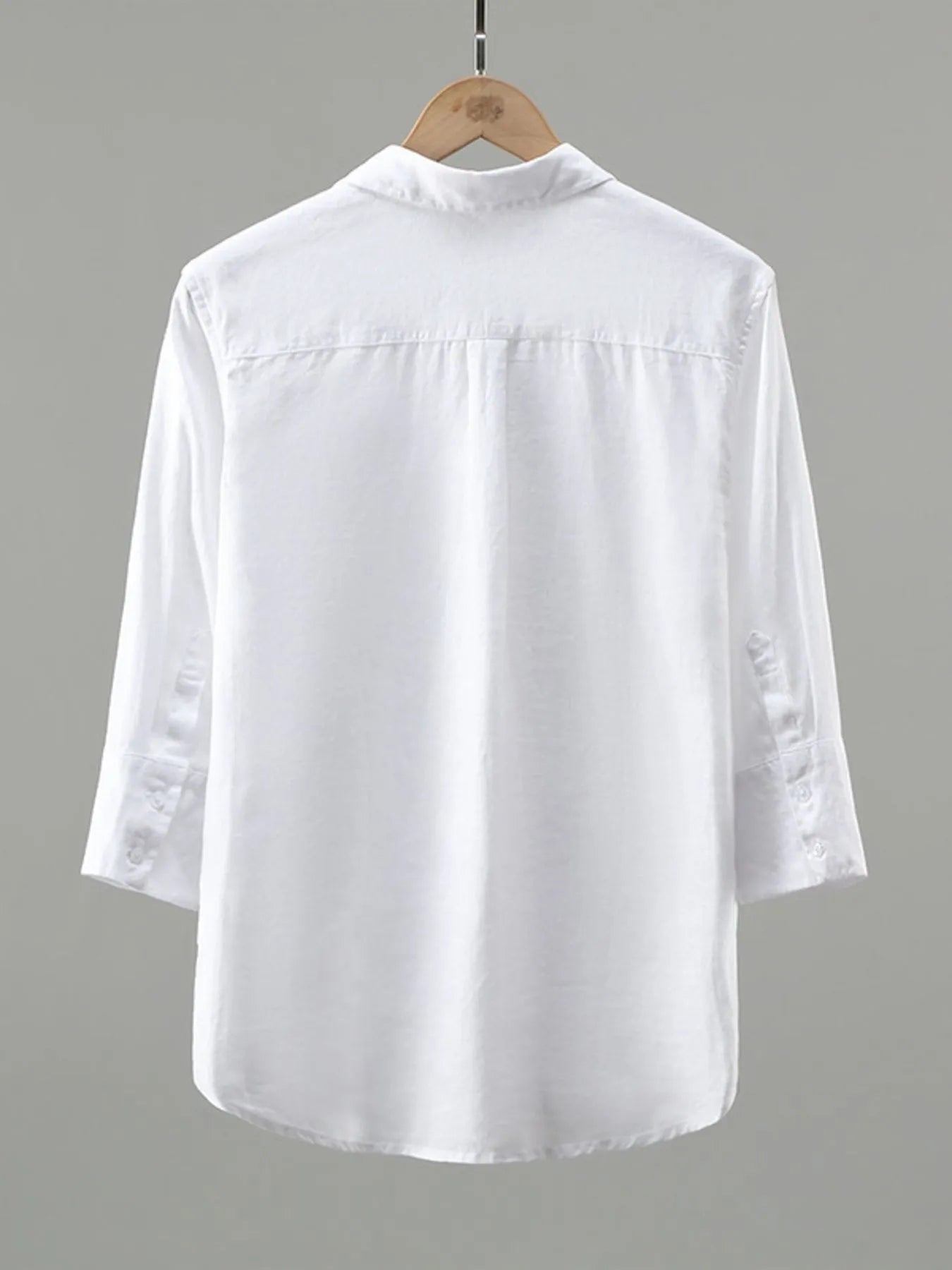 Men's plus size white button-up long sleeve shirt by Trendsi, displayed flat with collar and cuffs visible.
