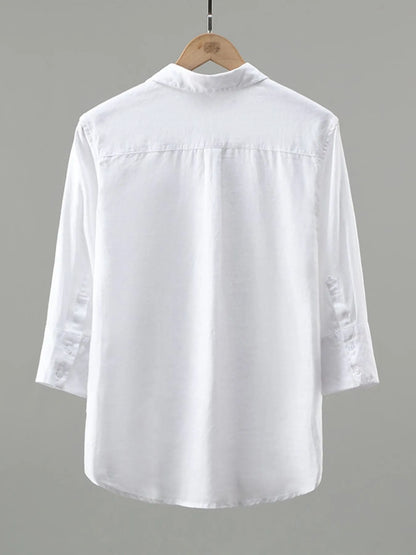 Men's plus size white button-up long sleeve shirt by Trendsi, displayed flat with collar and cuffs visible.