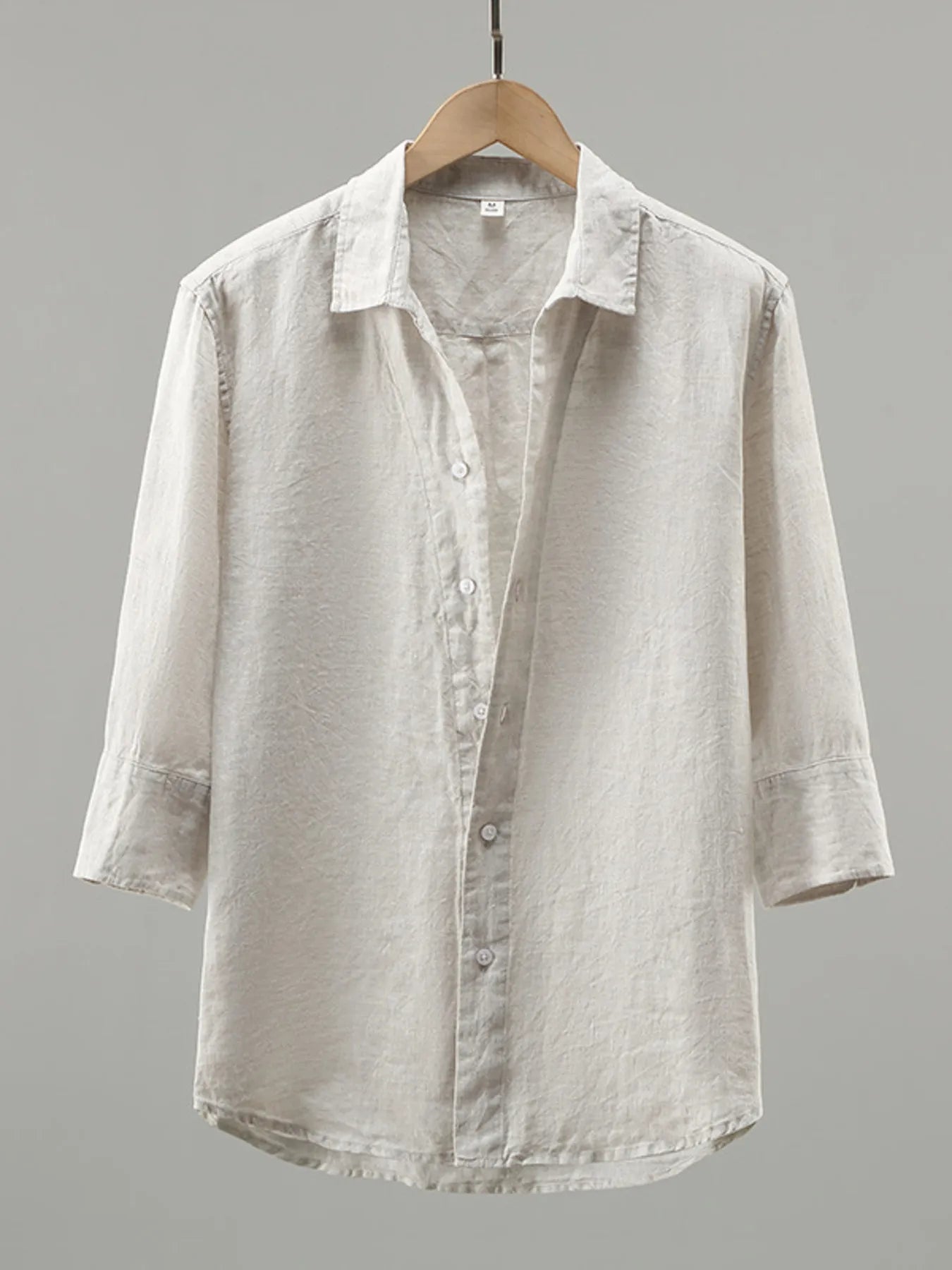 White men's plus size long sleeve button-up shirt by Trendsi, shown flat with collar and button details.