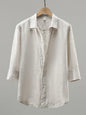 White men's plus size long sleeve button-up shirt by Trendsi, shown flat with collar and button details.