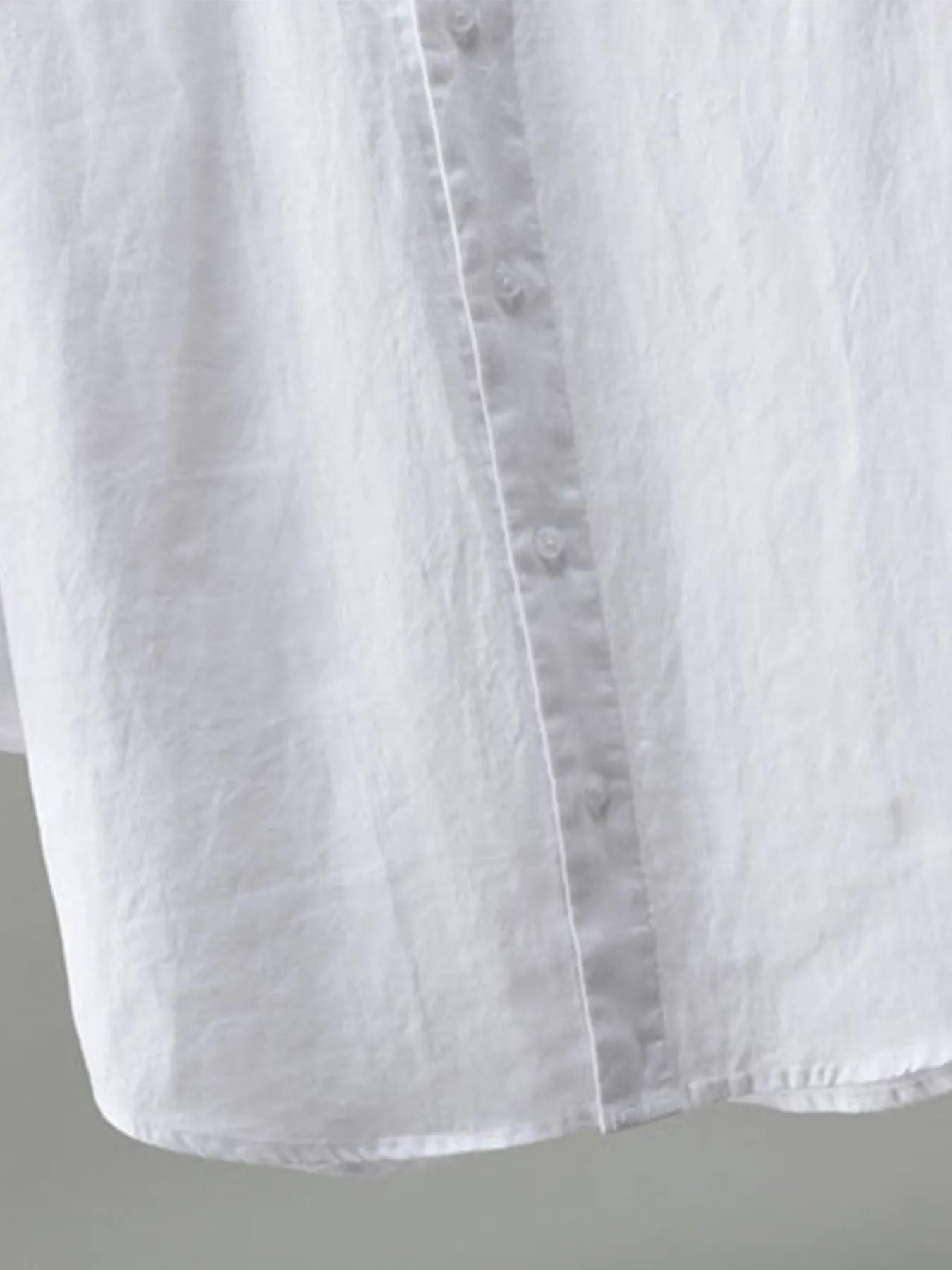 White men's plus size long sleeve button-up shirt by Trendsi, shown flat with collar and front buttons.