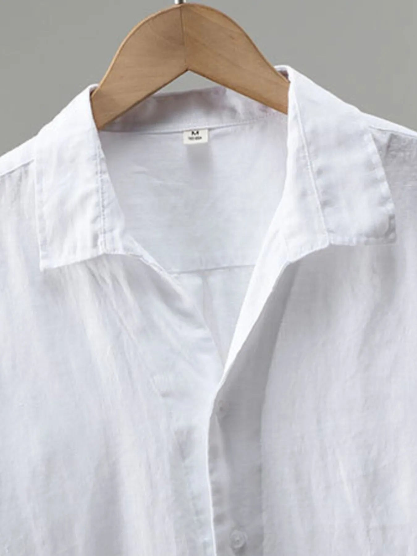 Men's plus size white button-up long sleeve shirt by Trendsi, casual fit, with collar and button closure, ideal for everyday wear.
