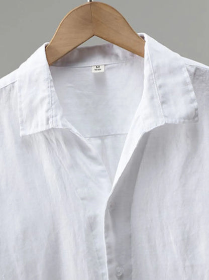 Men's plus size white button-up long sleeve shirt by Trendsi, casual fit, with collar and button closure, ideal for everyday wear.