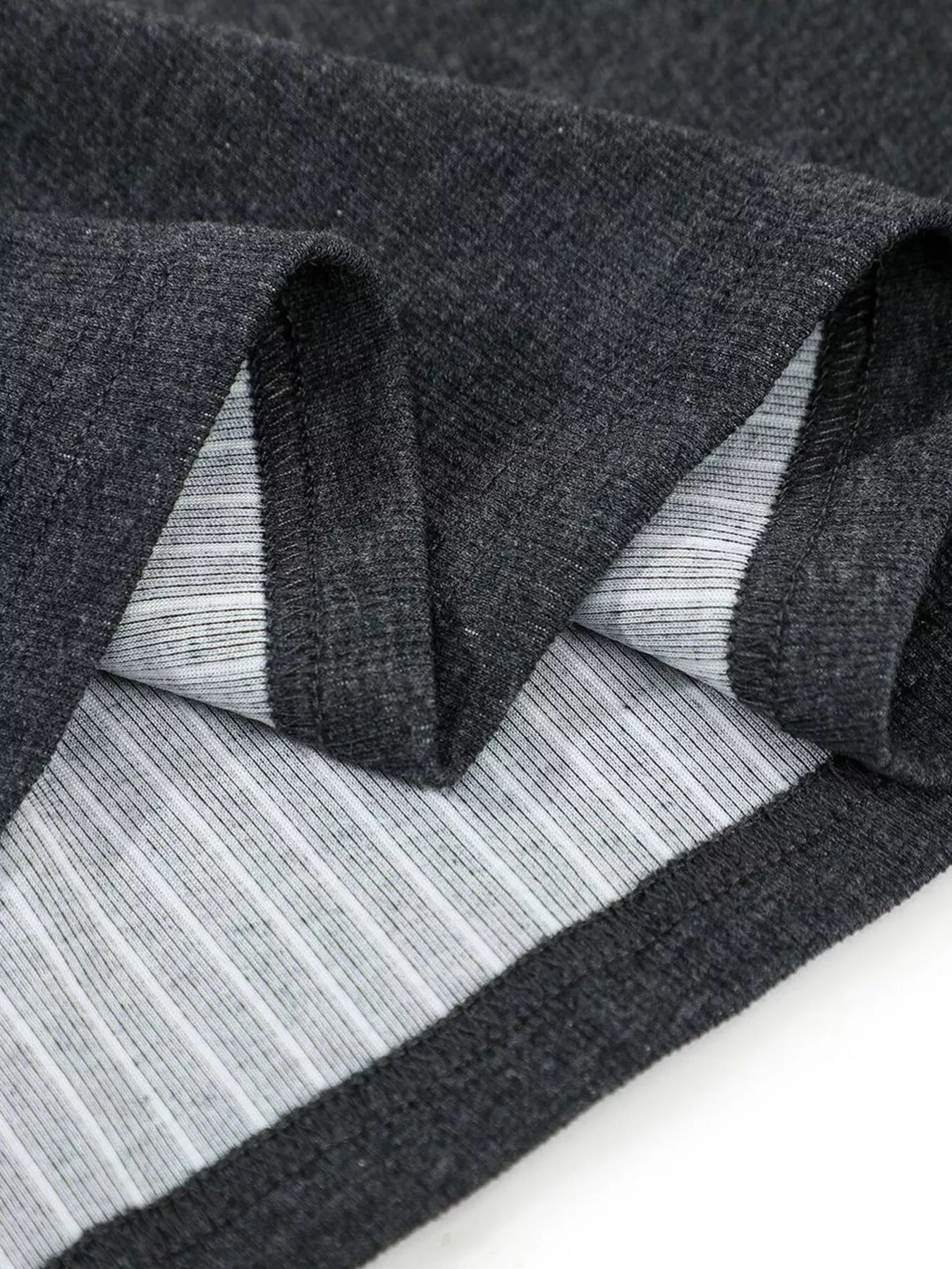 White men's textured short sleeve T-shirt from Trendsi, showing a close-up of the fabric and fit.