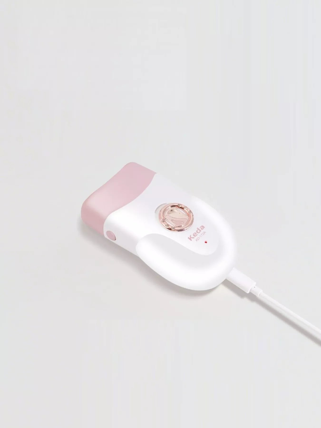 White electric clip wheel portable hair remover by Trendsi, compact design for quick and easy hair removal.